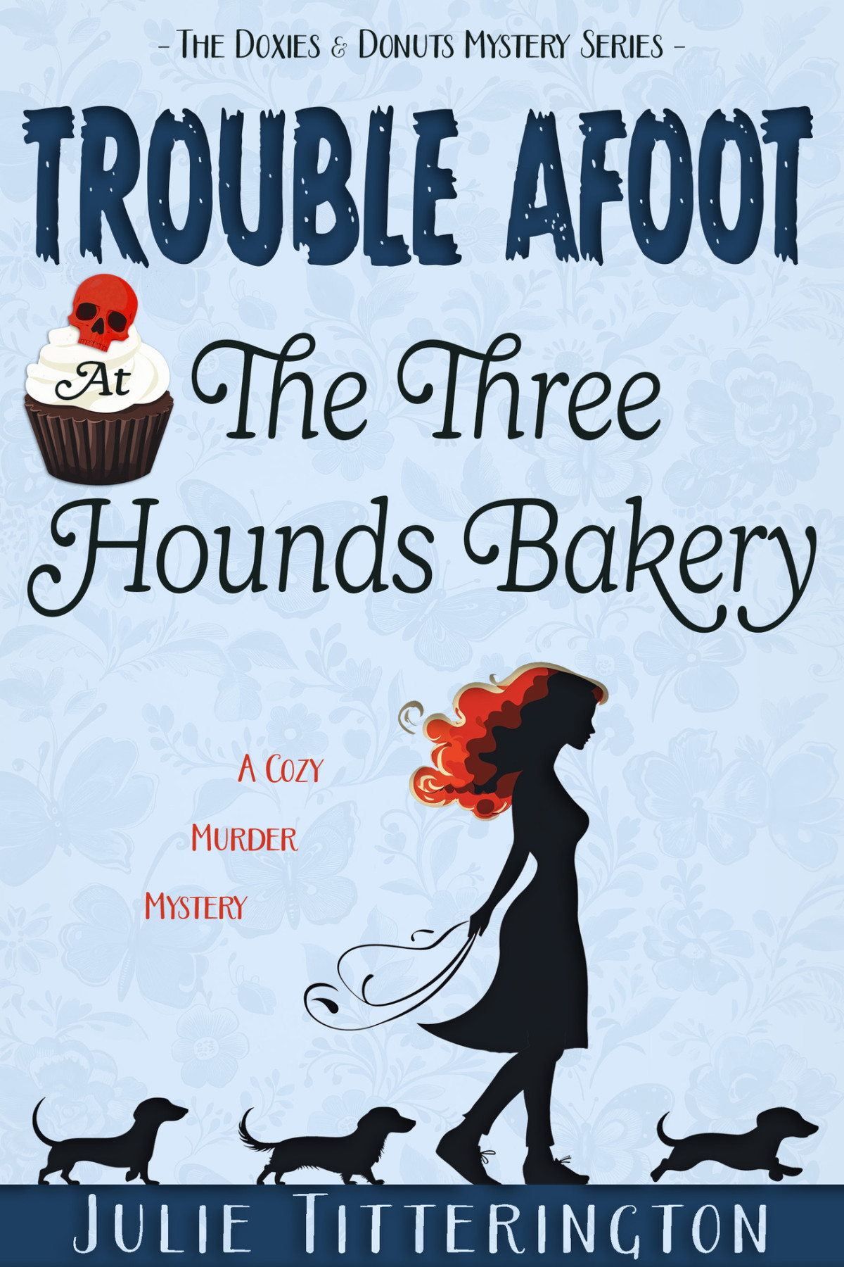Trouble Afoot At The Three Hounds Bakery A Cozy Murder Mystery The Doxies Donuts Mystery Series Book 1 Julie Titterington